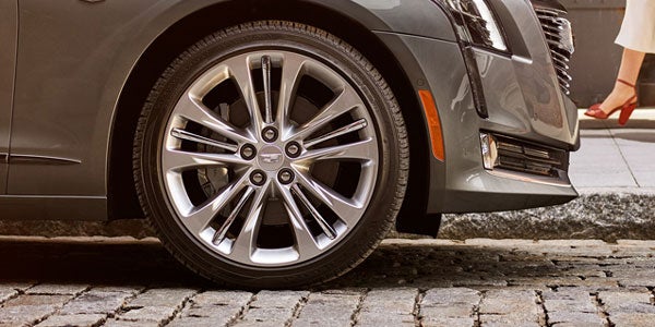 Cadillac tires on a stone road.