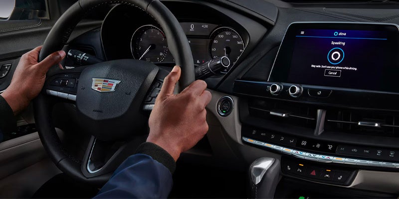 Hands on Cadillac steering wheel, 